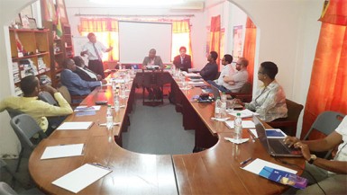 Head of FIFA Member Associations Primo Corvaro (standing) addressing members of the GFF Constitutional Reform Committee inclusive of the entity’s Normalization Committee yesterday at the Guyana Olympic House in Kingston during the opening day of the reform process.