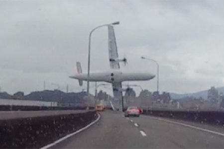 A still image taken from an amateur video shot by a motorist shows a TransAsia Airways plane cartwheeling over a motorway soon after the turboprop ATR 72-600 aircraft took off in New Taipei City February 4, 2015. REUTERS/AMVID via Reuters TV 