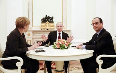 German Chancellor Angela Merkel, Russia’s President Vladimir Putin and French President Francois Hollande attend a meeting on resolving the Ukraine crisis at the Kremlin in Moscow February 6, 2015.  Reuters/Maxim Zmeyev