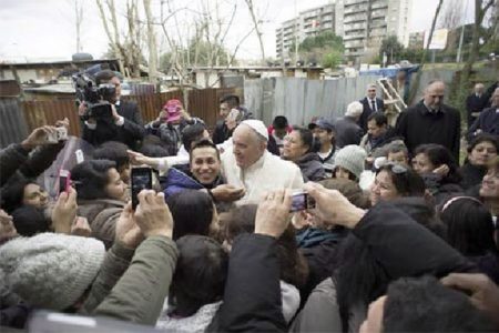 Pope Francis visits a shantytown on the outskirts of Rome February 8, 2015. REUTERS/Osservatore Romano