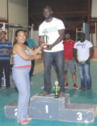 O.J Alleyne poses with his spoils after lifting the best Novices male lifter award. (Orlando Charles photo) 