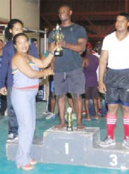 Rudolph Blackman collecting his trophies for winning the overall Junior title. (Orlando Charles photo)