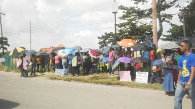UG staff picketing yesterday in front of main entrance to the Turkeyen Campus.