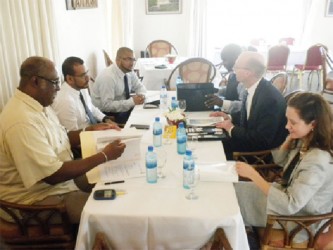 The Guyana team (left) at the meeting. (Ministry of Natural Resources photo) 
