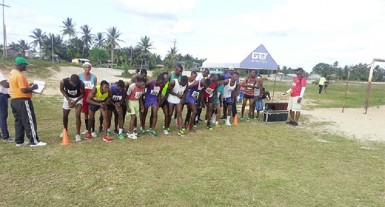 Runners with their fingers on their clocks prior to the start of the event. 