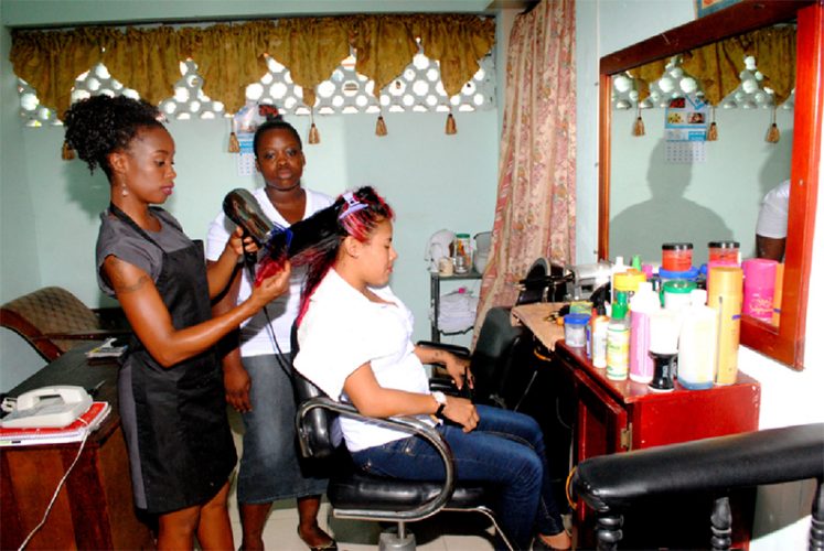 Jeemima Burke doing a practical class with two of her students