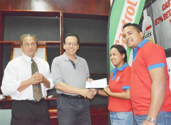 Guyoil’s brand manager, Nadia Sugrim handing over the company’s sponsorship to Howard Cox of the GBBC.  