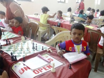 Publicizing a message, perhaps? Jack Samuel (in photo), is the boy who fiercely honoured the ‘honesty is the best policy’ principle in the recent Indian National Schools Chess Championships which were conducted in the U-5 , U-7 , U-9 , U-11 , U-13 , U-15 and U-17 age categories. Six hundred and twenty-seven chess players participated in the Championships in Goa. Playing the black pieces in the U-5 category, Samuel pointed out to his opponent as he resigned the game, that it was not ‘checkmate ‘ as he anticipated. White can capture with his rook thereby ending Black’s ambitious excursion into enemy territory. Samuel eventually lost the game and placed third at the U-5 level. Perhaps Samuel deserved a ‘fairness’ prize.  