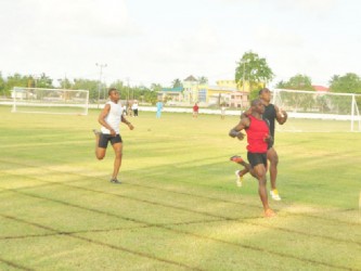 GDF’s Akeem Stewart takes the win in the open men’s 300m event. (Orlando Charles photo) 