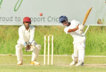 Action between Berbice and the President’s XI yesterday at the Everest Ground