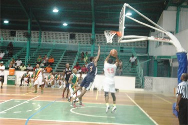  The Colts’ Shelroy Thomas (no.15) attempts a jump shot during his side’s huge victory against Linden’s Bankers Trust Falcons.  