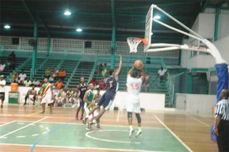  The Colts’ Shelroy Thomas (no.15) attempts a jump shot during his side’s huge victory against Linden’s Bankers Trust Falcons.
