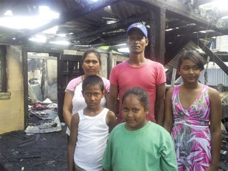 Cane harvester Delon Ramalho, his wife, Angela, and their three children, who lost their home in a fire at Port Mourant on Wednesday morning. 