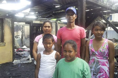 Cane harvester Delon Ramalho, his wife, Angela, and their three children, who lost their home in a fire at Port Mourant on Wednesday morning.