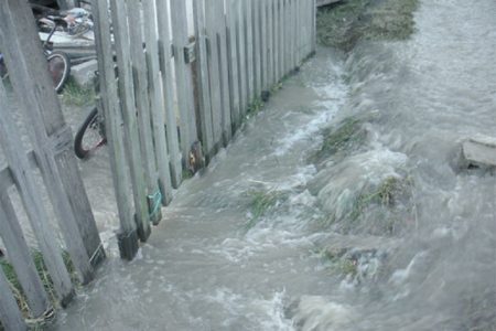 Water rushing into a resident’s home when Stabroek News visited.