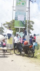 University of Guyana students plastered the words “All classes or no classes” on a billboard celebrating the university’s 50th anniversary at the entrance of the Turkeyen Campus.