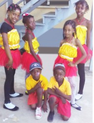 This composite photo shows the children on Friday morning before they left for Calcutta, Mahaicony. Standing from left are Asiyah Abel and Azaliah Fraser, six, while standing from right are Atesha Woolford and Martina Persaud. Kneeling in front row are Joel Justin Abel (right) and Rayden Abel. 