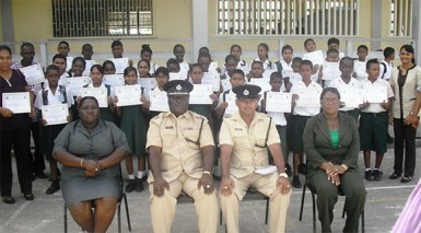 Deputy Commander, Stephen Mansel and others pose with the graduating students  