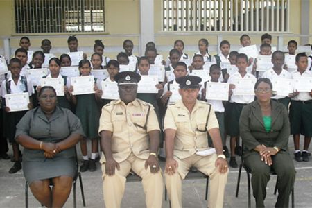 Deputy Commander, Stephen Mansel and others pose with the graduating students 