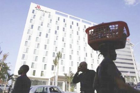 Prices at the Haiti Marriott will start at US$149 a night, for an introductory period before rising to US$179 a night. Pedestrians walk past the Marriott Port-au-Prince Hotel in Port-au-Prince February 24, 2015. (Reuters)