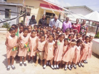 Students of the Good Hope Primary School with President Donald Ramotar (third from left in back row) 