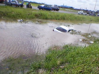 Trevor Abrams’ submerged vehicle following the fatal attack yesterday. After being shot, Abrams apparently tried to drive himself to the hospital but lost control of his vehicle and ended up in a nearby trench.