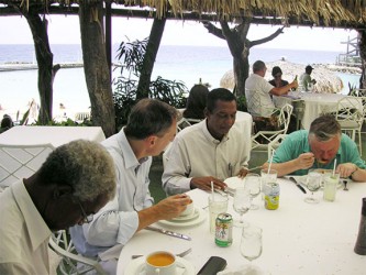 Anatoly Karpov, the 12th World Chess Champion, is pictured at extreme right having lunch at a hotel in Curacao. Seated on his immediate right is Stabroek News chess columnist Errol Tiwari. The picture was taken in 2010. 