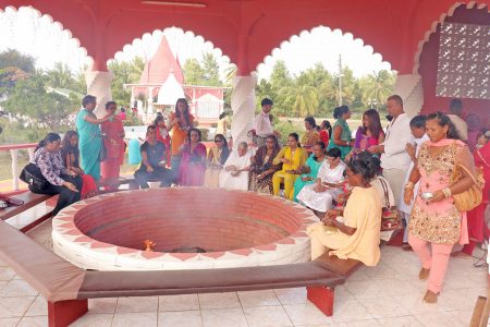 Devotees making offerings to Lord Shiva during yesterday’s annual observances at the Cove and John Ashram.