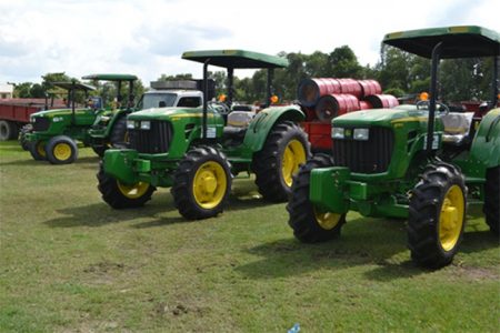 The tractors and bins given to the Region Four Neighbourhood Democratic Councils (GINA photo)