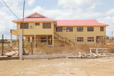 Weeds fill the completed but unused Lethem court house. 