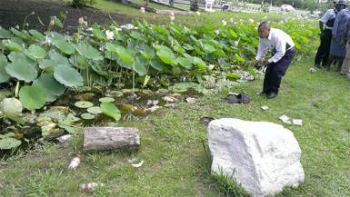 A crime scene investigator examines the scene before the body of the unidentified man was pulled out. 