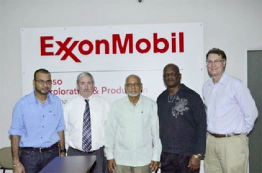 President Donald Ramotar (centre), Natural Resources and the Environment Minister, Robert Persaud (left) and ExxonMobil Country Manager,  Jeff Simon (second from left) along with staff at ExxonMobil’s Head Office, New Market Street (GINA photo) 