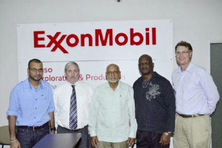 President Donald Ramotar (centre), Natural Resources and the Environment Minister, Robert Persaud (left) and ExxonMobil Country Manager,  Jeff Simon (second from left) along with staff at ExxonMobil’s Head Office, New Market Street (GINA photo)

