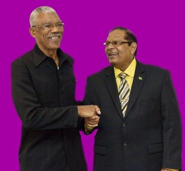 APNU+AFC Presidential candidate David Granger (left) and Prime Ministerial candidate Moses Nagamootoo shake hands at the formal launch of the alliance yesterday at the Guyana Pegasus.  (APNU+AFC photo) 