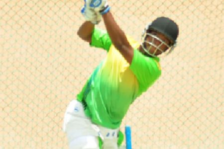 West Indies player and Guyana Captain Leon Johnson smashes one out of the nets during the team’s final session
