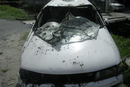 The damaged car that was used in the robbery.

