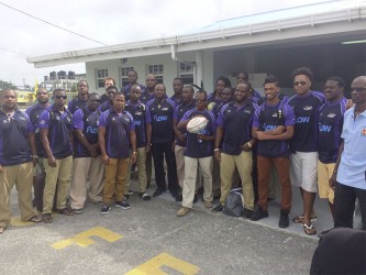 The Barbados 15s rugby squad pose for a photo shortly after arrival yesterday.  