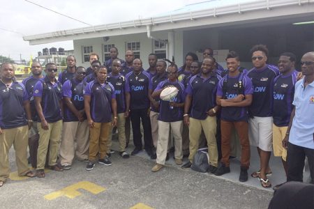 The Barbados 15s rugby squad pose for a photo shortly after arrival yesterday.
