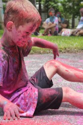 This young boy was in his own little world, enjoying the wonder of the colour red. 