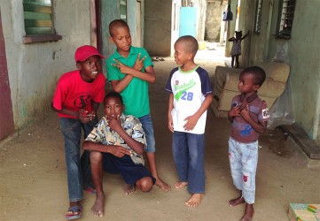 These boys who were home early after a double session at school, were happy to have their photo taken 