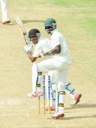 Leon Johnson reaches his 22nd first class half century with a streaky shot for four. (Orlando Charles photo) 