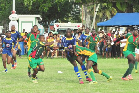 Rugby action on Saturday at the National Park during Guyana’s 48-22 rout of Barbados. (Orlando Charles photo)