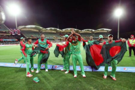 The victorious Bangladesh side celebrate their upset win over England and their advance to the World Cup quarter finals. (Photo courtesy ICC CWC website)