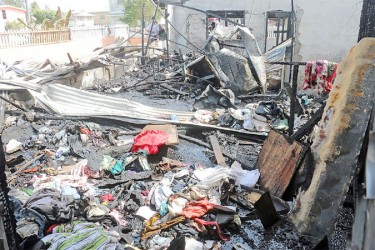 The charred remains of Amiba Moore’s home after a fire yesterday (Photo by Arian Browne)