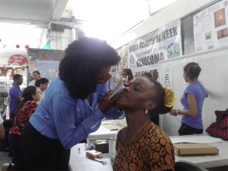 Optometrist Antonia McCurchin tests the eye pressure of a patient at Thursday’s Glaucoma Screening event.