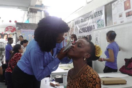 Optometrist Antonia McCurchin tests the eye pressure of a patient at Thursday’s Glaucoma Screening event.