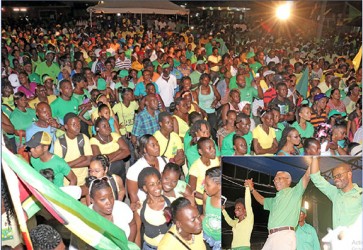 United we stand: A section of the crowd of thousands in attendance at the launch of the APNU+AFC coalition’s elections campaign in Linden last night. Inset is coalition leader David Granger (centre) holding hands with APNU regional executive Vanessa Kissoon and Region 10 Chairman Sharma Solomon to the thunderous applause and cheers of the crowd. (Photos by Arian Browne)