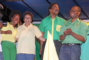 APNU’s key Linden members Vanessa Kissoon and Sharma Solomon posing with Alliance for Change member Valerie Garrido-Lowe and APNU member Basil Williams moments after the unity rally in the mining town ended last night. (Arian Browne photo).