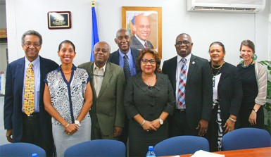 From left to right: Dr Jules Grande Pierre, Director PSI Anick Supplice Dupuy, Director of the Directorate of Family Health Dr Reynold Grand-Pierre, Dr Dellonay Brunel, Minister of Health Florence Duperval Guillaume, Director PANCAP Dereck Springer, National AIDS Programme Coordinator Dr Joelle Deas, PSI Social Marketing Consultant Sarah Romorini in the Ministry of Health Boardroom in Haiti. 