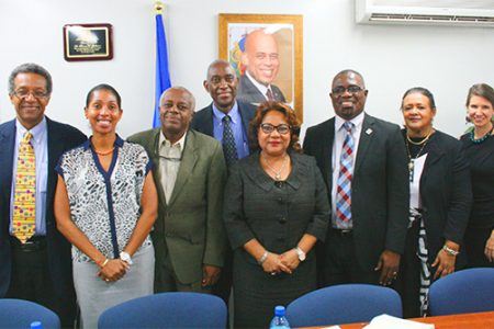 From left to right: Dr Jules Grande Pierre, Director PSI Anick Supplice Dupuy, Director of the Directorate of Family Health Dr Reynold Grand-Pierre, Dr Dellonay Brunel, Minister of Health Florence Duperval Guillaume, Director PANCAP Dereck Springer, National AIDS Programme Coordinator Dr Joelle Deas, PSI Social Marketing Consultant Sarah Romorini in the Ministry of Health Boardroom in Haiti. 